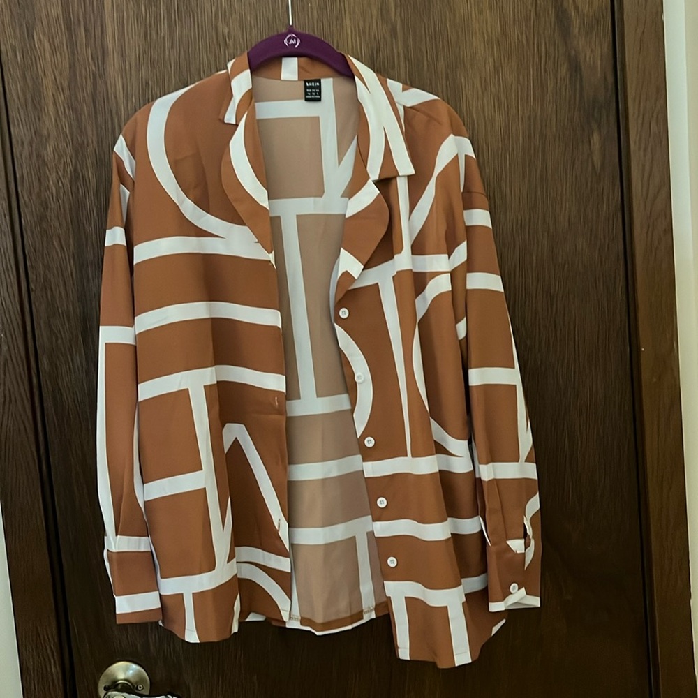Size medium, brown and white long sleeve shirt from Sheen never worn